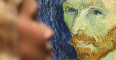 A gallery worker views Dutch painter Vincent Van Gogh's 1889 work "Self Portrait" during a preview for the exhibition "Van Gogh: Poets and Lovers" at the National Gallery, London, U.K., Sept. 9, 2024. (EPA Photo)