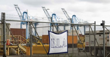 A banner for the International Longshoremen's Association hangs on the fence outside the Packer Marine Terminal in Philadelphia, Pennsylvania, U.S., Oct. 1, 2024. (AFP Photo)
