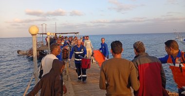 Medics and people wait for possible survivors after a boat sank at a harbor in Marsa Alam, Red Sea Governorate, in Egypt, Nov. 2024. (EPA Photo)