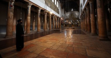 Orthodox priest Issa Thaljieh stands in the Church of the Nativity as no tourists are seen in Bethlehem in the Israeli-occupied West Bank, Palestine, Nov. 25, 2024. (Reuters Photo)