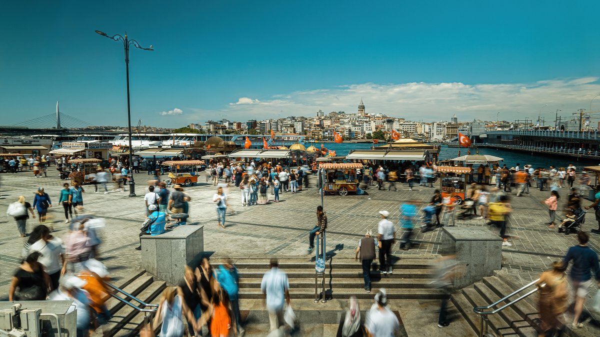 People walk in Eminönü, famous for fish and bread boats, Istanbul, Türkiye, June 20, 2021. (Shutterstock Photo)