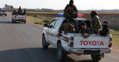 Syrian army personnel travel in a military vehicle as they head toward Latakia to join the fight against the fighters linked to Syria's ousted leader Bashar Assad, Aleppo, Syria, March 7, 2025. (REUTERS)