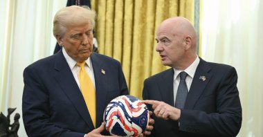 FIFA President Gianni Infantino (R) presents President Donald Trump with the new FIFA Club World Cup official ball in the Oval Office of the White House, Washington, U.S., March 7, 2025. (AP Photo)