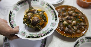 Snails are served in a stew for a family to break their Ramadan fast, Sfax, Tunisia, March 29, 2025. (AP Photo)