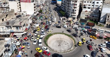 A drone view shows traffic passing by residential buildings in Latakia, Syria March 11, 2025. (Reuters File Photo)
