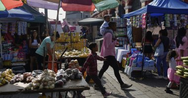 Vendors selling products in a street market, Caracas, Venezuela, April 11, 2025. (AP Photo)
