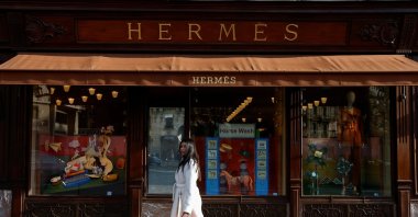 A woman walks in front of a Hermes store, Paris, France, Feb. 14, 2025. (Reuters Photo)