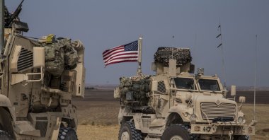 American military convoy stops near the town of Tel Tamr, north Syria, Sunday, Oct. 20, 2019. (AP File Photo)