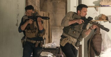 This image released by Amazon shows Jon Bernthal (L) and Ben Affleck in a scene from "The Accountant 2." (AP Photo)