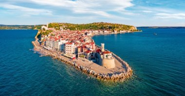 Attractive morning cityscape of Piran, highlighting the town's charming coastal beauty and historic architecture. (Shutterstock Photo)
