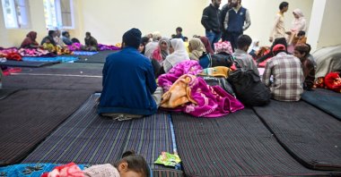 A girl sleeps as people take shelter at a school after being evacuated to safer places, Uri, Kashmir, May 11, 2025. (AFP Photo)