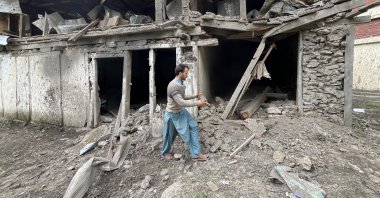 A man inspects damage caused by an Indian attack in Muzaffarabad, Pakistan-ruled Kashmir, May 10, 2025. (AA Photo)