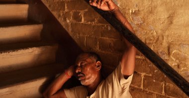 An Indian worker rests during a hot afternoon in the Burrabazar neighborhood in Kolkata, India, May 13, 2025. (EPA Photo)