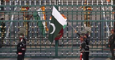 Pakistan's Rangers soldiers and Indian Border Security Forces soldiers lower their flags during a daily closing ceremony at the Wagah, on Pakistan and India border, near Lahore, Pakistan, May 5, 2025. (AP Photo)
