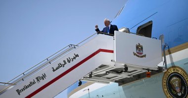 U.S. President Donald Trump gestures with a clenched fist as he prepares to board Airforce One at the end of his Middle East tour, Dubai, United Arab Emirates (UAE), May 16, 2025. (AFP Photo)