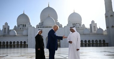 Yousif al-Obaidli, (R) the director-general of the Sheikh Zayed Grand Mosque, accompanies U.S. President Donald Trump on a tour of the mosque in Abu Dhabi, UAE, May 15, 2025. (AFP Photo)
