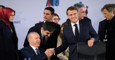 President Recep Tayyip Erdoğan shakes hands with French President Emmanuel Macron ahead of a summit on defense and security with leaders of the EU, Tirana, Albania, May 16, 2025. (AP Photo)