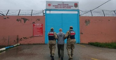 A Gülenist Terror Group (FETÖ) suspect is escorted by police, Erzurum province, Türkiye, May 14, 2025 (AA Photo)