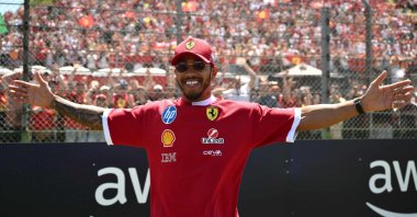 Ferrari's British driver Lewis Hamilton gestures to supporters before the 2025 Emilia Romagna Formula One Grand Prix at the Imola autodrome, Imola, Italy, May 18, 2025. (AFP Photo)