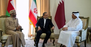 This handout picture provided by the Iranian Foreign Ministry shows Foreign Minister Abbas Araghchi (C) meeting with Qatar's Prime Minister and Foreign Minister Mohammed bin Abdulrahman al-Thani (R) and Oman's Foreign Minister Sayyid Badr al-Busaidi (L), in Tehran, May 18, 2025. (Photo by Iranian Presidency / AFP)