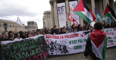 Students wave Palestinian flags and chant pro-Gaza slogans during a demonstration at the Pantheon monument, Paris, France, May 3, 2024. (AP Photo)