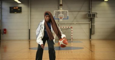 Former player Salimata Sylla poses before a women’s basketball tournament where players can wear a headscarf, Aubervilliers near Paris, April 27, 2025. (AP Photo)