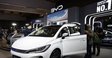 Visitors gather near a BYD M6 Chinese electric car during the Periklindo Electric Vehicle Show (PEVS) 2025, Jakarta, Indonesia, April 29, 2025. (EPA Photo)