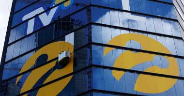Workers install logos of Turkcell, the country's top mobile operator, Istanbul, Türkiye, June 29, 2016. (Reuters Photo)