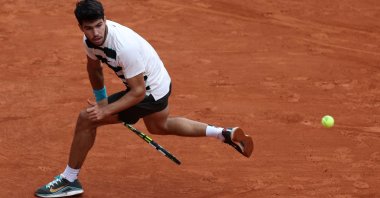 Spain's Carlos Alcaraz plays a shot against Italy's Giulio Zeppieri during a Frenc Open men's singles match in Paris, France, May 26, 2025. (AFP Photo)