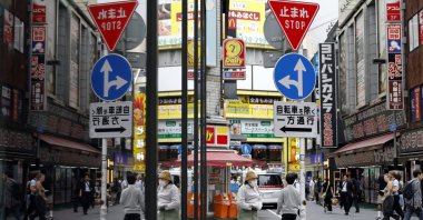 People walk through Tokyo's Shinjuku business and shopping district, Tokyo, Japan, May 16, 2025. (EPA Photo)