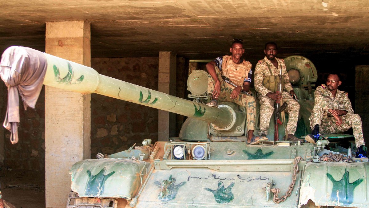 Sudanese army soldiers sit atop a parked tank after their capture of a base used by the rival Rapid Support Forces (RSF) paramilitaries after the latter group evacuated from the Salha area of Omdurman, Sudan, May 26, 2025. (AFP Photo)
