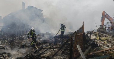 Ukrainian rescuers work at the site of a residential area struck by a rocket as a result of an overnight strike amid the ongoing Russian invasion, in a village near Kyiv, Ukraine, May 25, 2025. (EPA Photo)