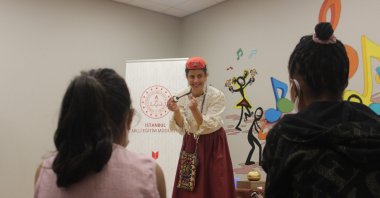 A teacher from the Istanbul Fairy Tale School explains a story to young patients during a Masalhane session, Istanbul, Türkiye, May 22, 2025. (AA Photo)