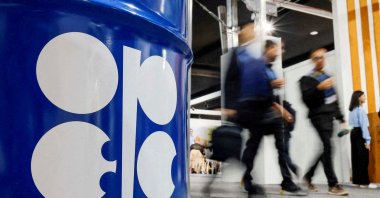 People walk past an installation depicting a barrel of oil with the OPEC logo at the COP29 United Nations climate change conference, Baku, Azerbaijan, Nov. 19, 2024. (Reuters Photo)
