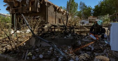 An emergency service member works at the site where Russian drones damaged several private houses, amid Russia's attack on Ukraine, Zaporizhzhia, Ukraine, June 1, 2025. (Reuters Photo)