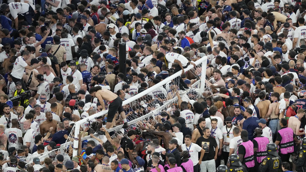 Fans of PSG invade the pitch after the Champions League final match between Paris Saint-Germain and Inter Milan at the Allianz Arena, Munich, Germany, May 31, 2025. (AP Photo)