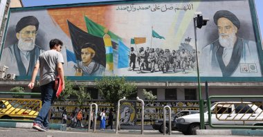 Iranians walk past portraits of Ayatollah Ali Khamenei (L) and late Iranian supreme leader Ayatollah Ruhollah Khomeini in Tehran, Iran, June 1, 2025. (EPA Photo)